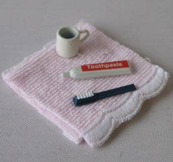 Tc0083 - Set mit Zahnbürsten und rosa Handtuch